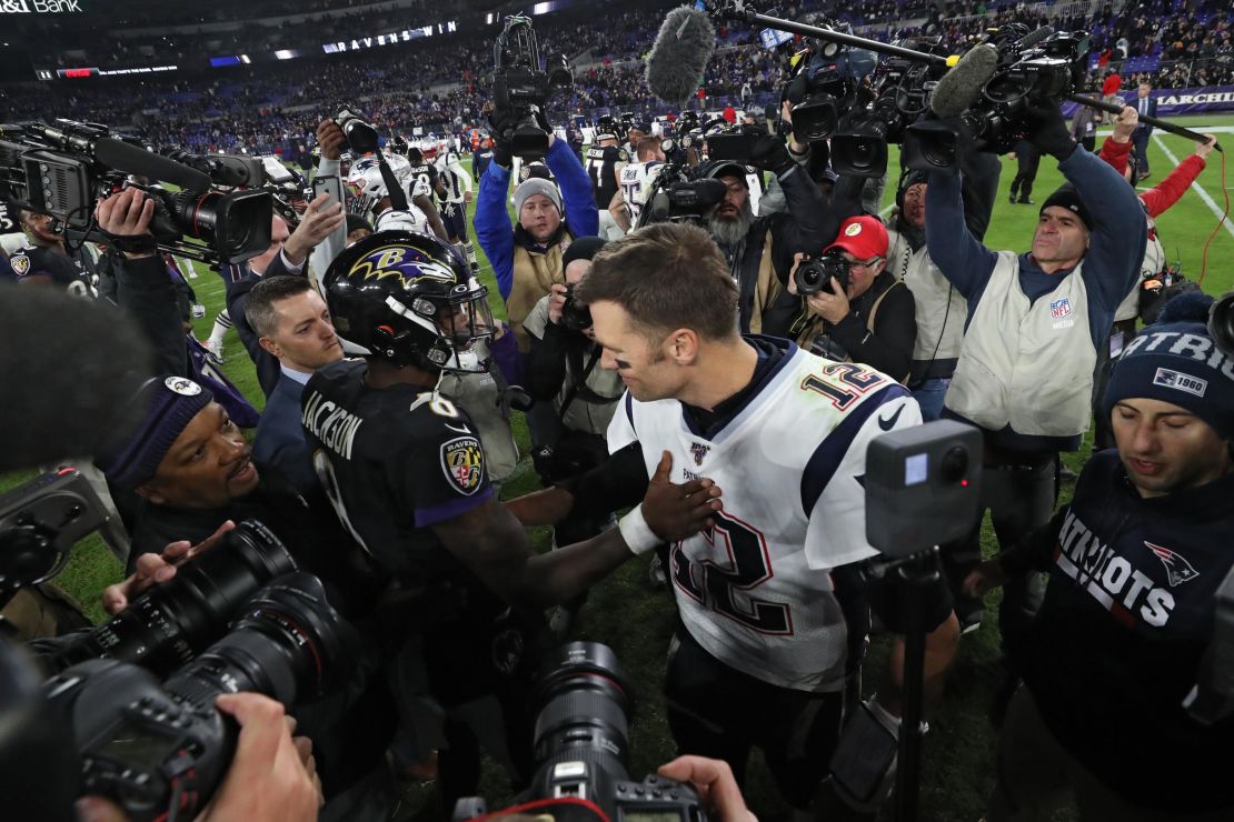 Jackson and Brady shake hands after the Ravens' win.