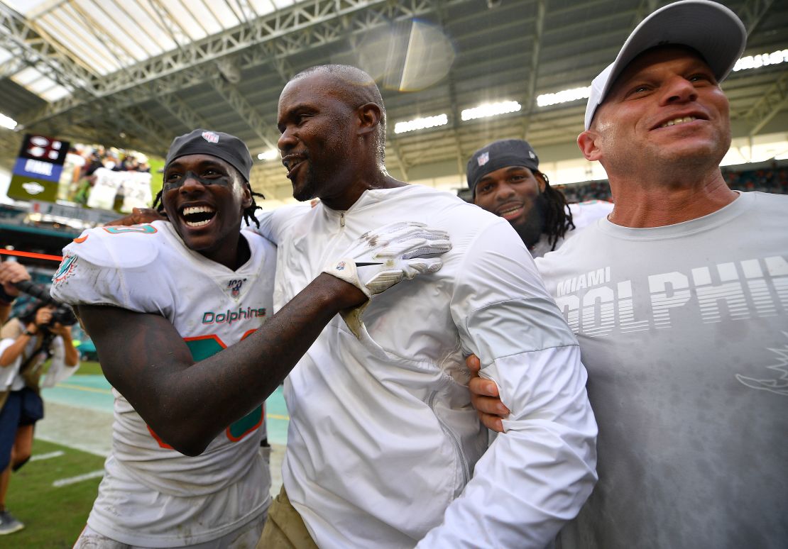 Miami head coach Brian Flores celebrates his first victory against the Jets.