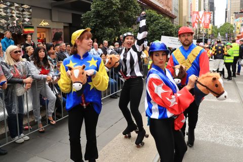Performers dance during the parade through the streets of Melbourne, which takes place the day before the famed "race that stops a nation."