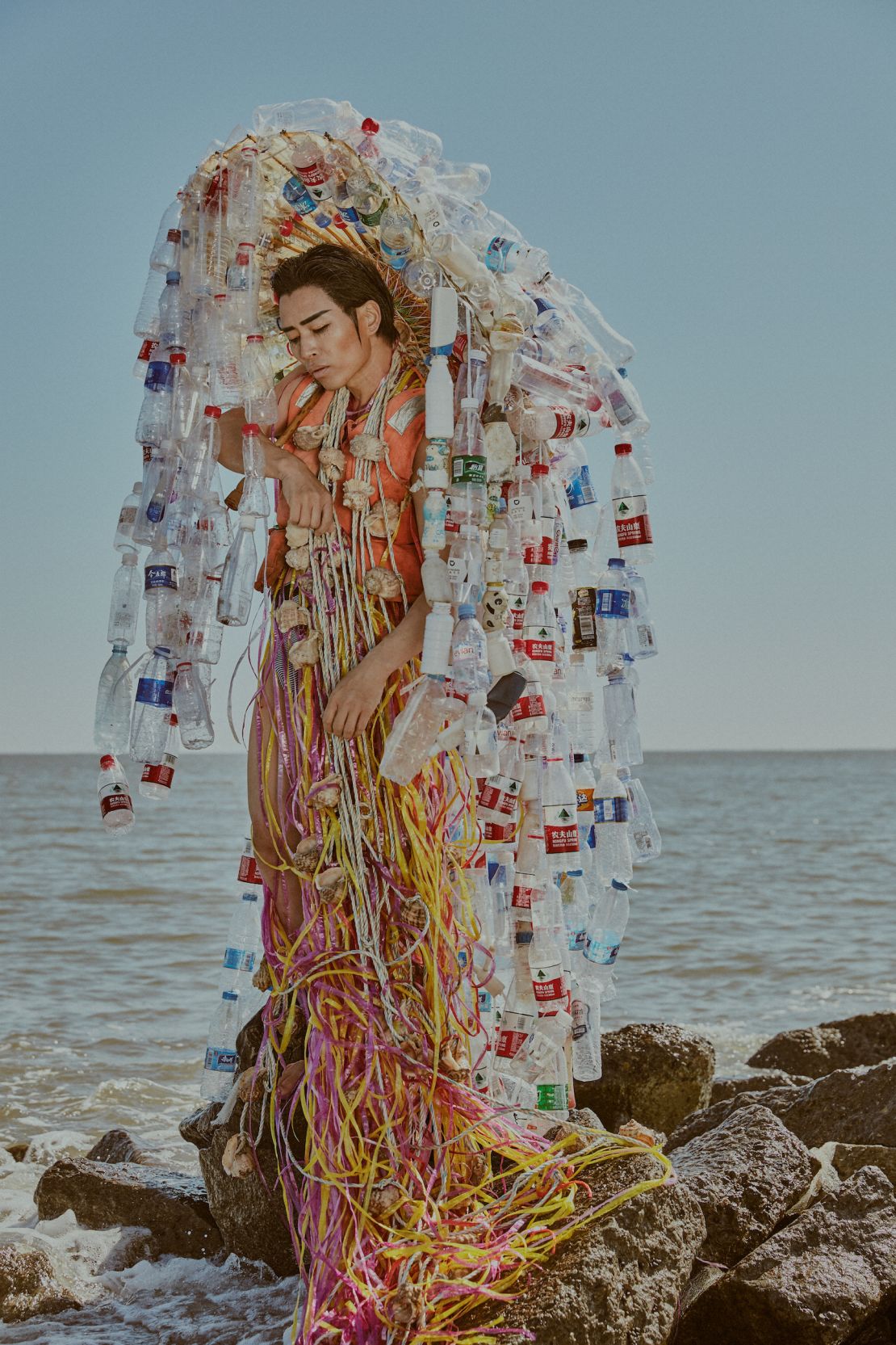 An elaborate outfit made from discarded plastic bottles.