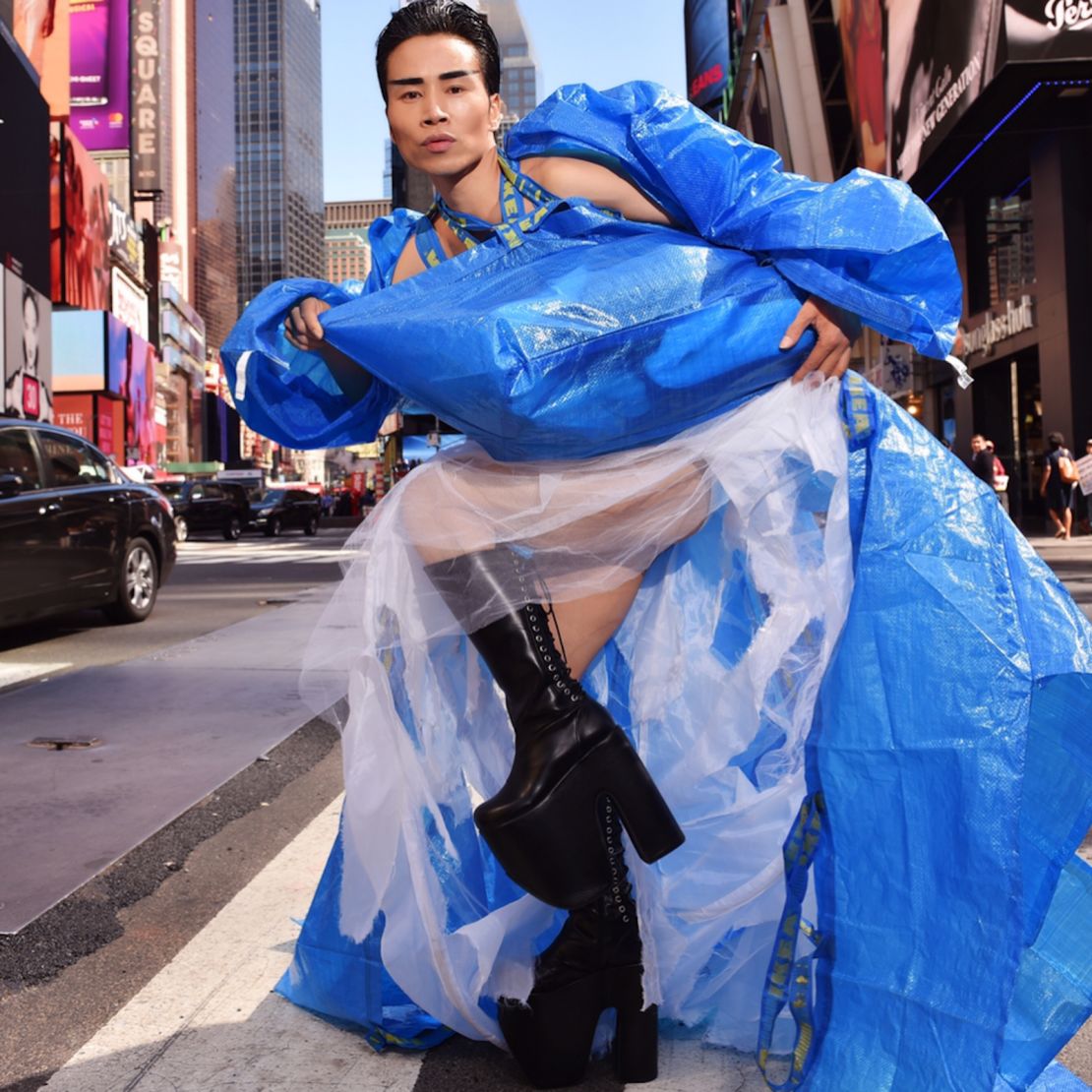 An image taken in New York's Times Square shows Wan dressed in a bright blue gown made of IKEA shopping bags.