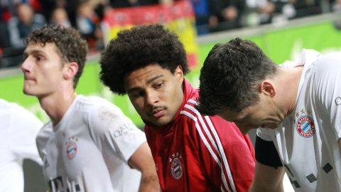 Bayern Munich players react after their side's 5-1 hammering against Eintracht Frankfurt, the team's second league defeat.