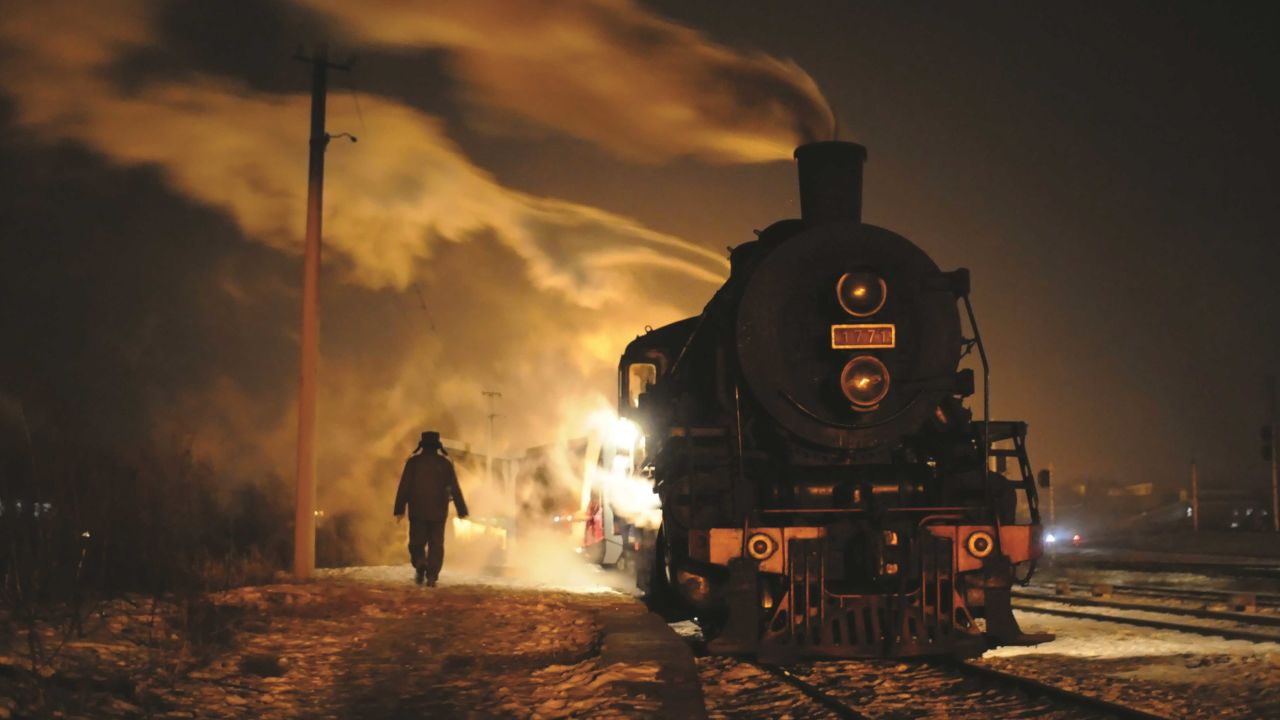 <strong>Light and steam:</strong> In China, the photographers took this image of a Class SY No. 1771 on a local passenger train at the Tiefa Mine Railway.