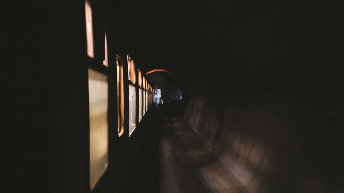 In the UK, a BR (WR) Modified Hall No. 7903 train dubbed "Foremarke Hall" passes through the Green Tunnel on the Gloucestershire Warwickshire Steam Railway in England.