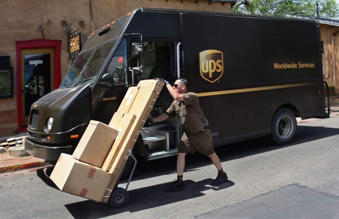 A UPS worker delivers boxes of merchandise to an art gallery in Santa Fe, New Mexico.
