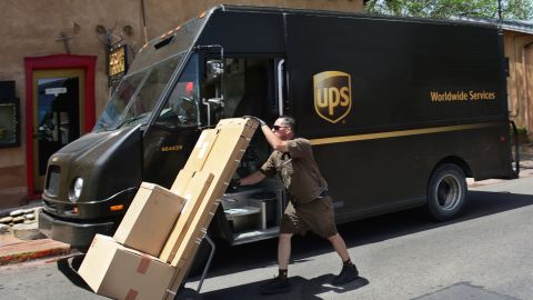 A UPS worker delivers boxes of merchandise to an art gallery in Santa Fe, New Mexico.