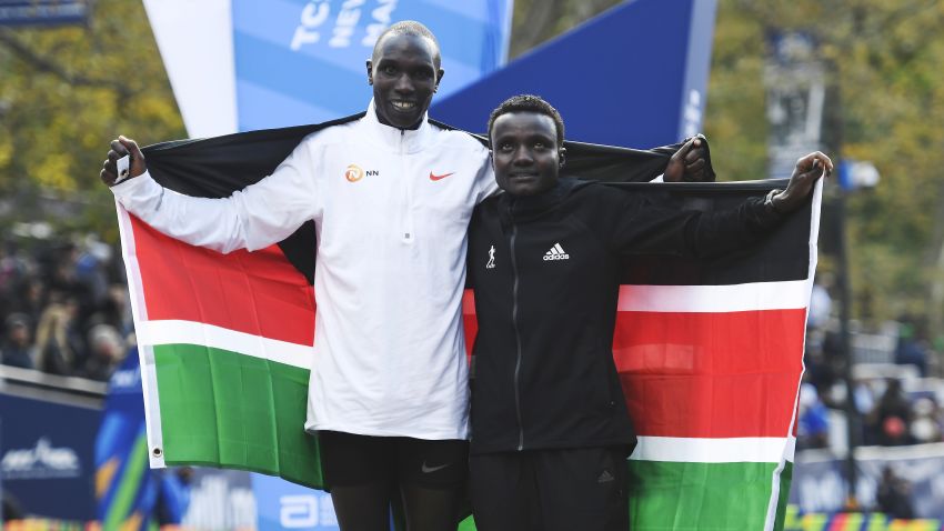 NEW YORK, NEW YORK - NOVEMBER 03: Geoffrey Kamworor and Joyciline Jepkosgei of Kenya pose with the Kenyan flag after winning the Mens' and Womens' Division of the 2019 TCS New York City Marathon on November 03, 2019 in New York City. (Photo by Sarah Stier/Getty Images)