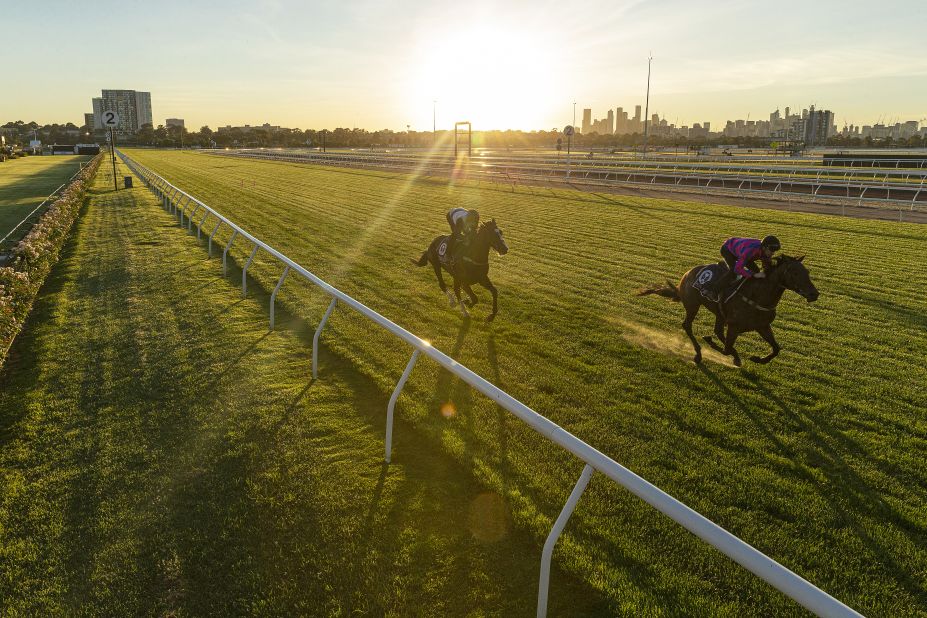 Glenn Boss rides Melbourne Cup contender Constantinople (left) and Jye McNeil rides Huntly Castle (right) during a trackwork session at Flemington Racecourse.