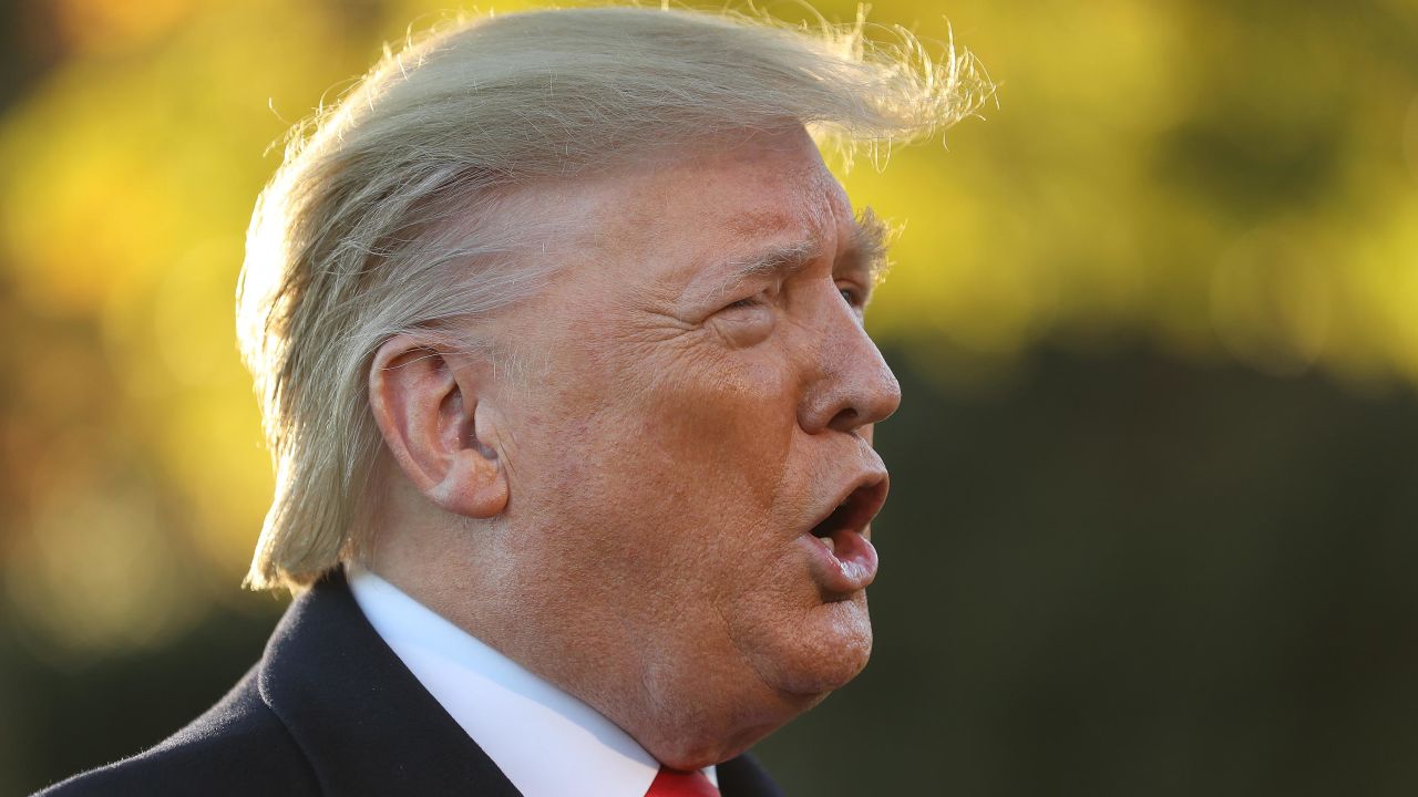 President Donald Trump talks to reporters before departing the White House, November 1.