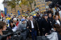 Democratic presidential candidate, South Bend, Indiana, Mayor Pete Buttigieg walks with his husband Chasten Buttigieg before the Iowa Democratic Party Liberty & Justice Celebration on November 1, 2019 in Des Moines, Iowa. 