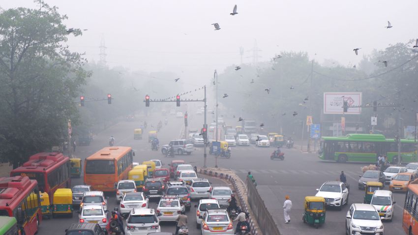 In this Sunday, Nov. 3, 2019, photo, vehicles wait at a crossing amidst morning smog in New Delhi, India. Authorities in New Delhi are restricting the use of private vehicles on the roads under an "odd-even" scheme based on license plates to control vehicular pollution as the national capital continues to gasp under toxic smog. (AP Photo/Manish Swarup)