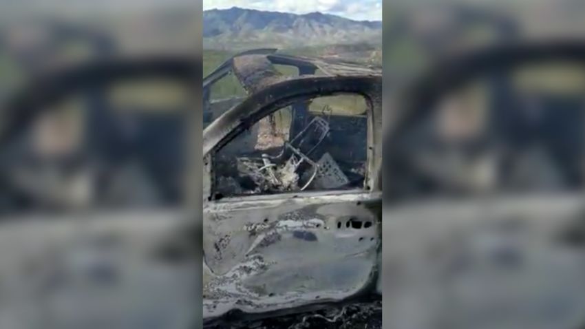 The burnt wreckage of a vehicle transporting a Mormon family living near the border with the U.S. is seen, after the family was caught in a crossfire between unknown gunmen from rival cartels, in Bavispe, Sonora, Mexico November 4, 2019, in this screengrab from a video obtained from social media. 