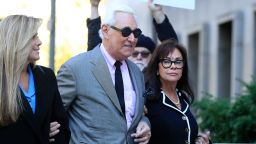 Roger Stone, center, with his wife, Nydia Stone, right, arrive at the federal court in Washington, Tuesday, November 5. Stone, a longtime Republican provocateur and former confidant of President Donald Trump, goes on trial over charges related to his alleged efforts to exploit the Russian-hacked Hillary Clinton emails for political gain. 