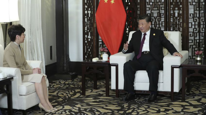 In this Monday, Nov. 4, 2019, photo released by China's Xinhua News Agency, Chinese President Xi Jinping, right, talks with Hong Kong Chief Executive Carrie Lam during a meeting in Shanghai, China. Lam is here for the second China International Import Expo (CIIE). (Ju Peng/Xinhua via AP)