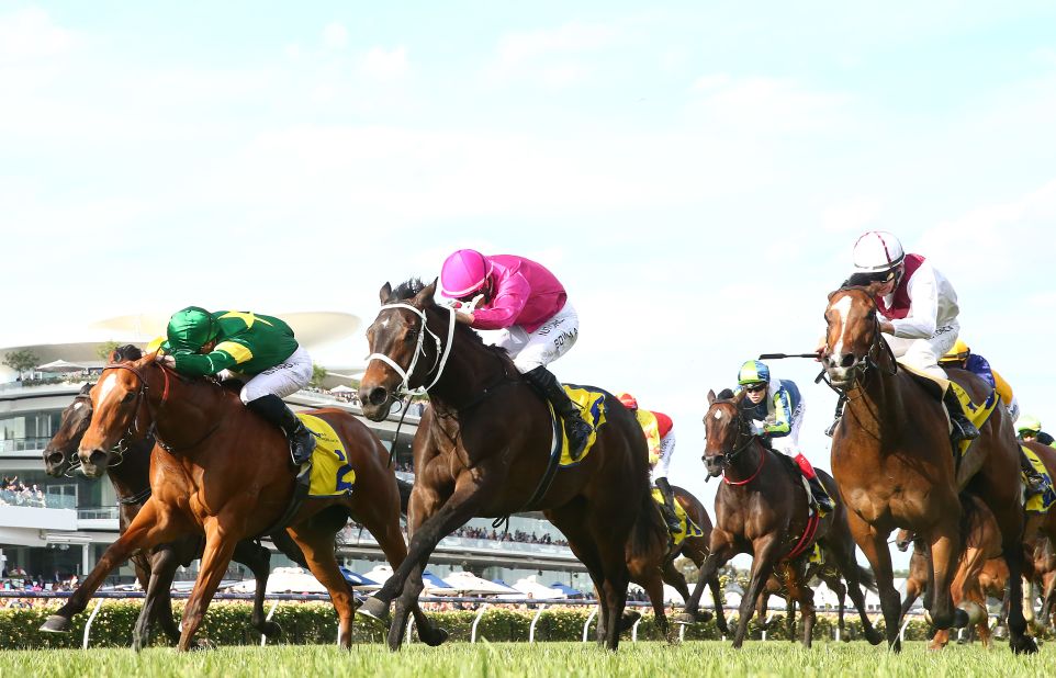 James McDonald (in second) rides Akari to win the Hong Kong Jockey Club Stakes.