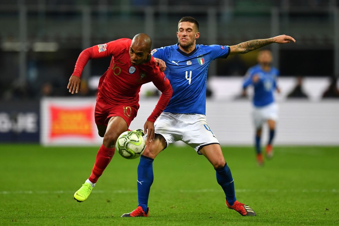 Mario hurdles the challenge of Cristiano Biraghi of Italy during their UEFA Nations League clash.