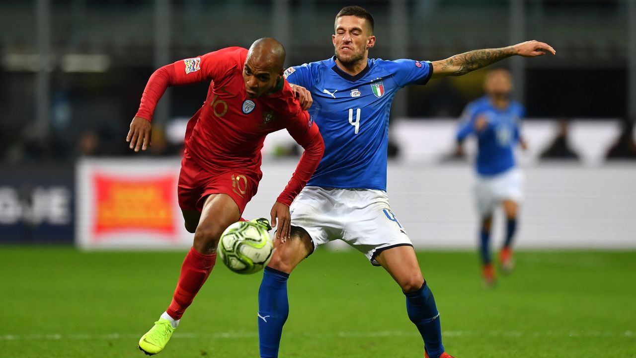 Mario hurdles the challenge of Cristiano Biraghi of Italy during their UEFA Nations League clash.