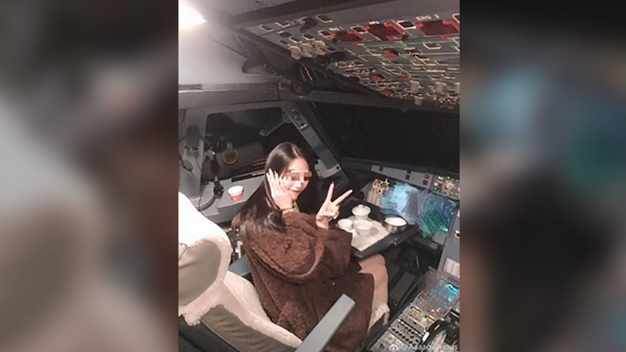 This photo, which shows a Chinese woman taking the pilot's seat during a flight, has sparked controversy on Chinese social media over air safety.