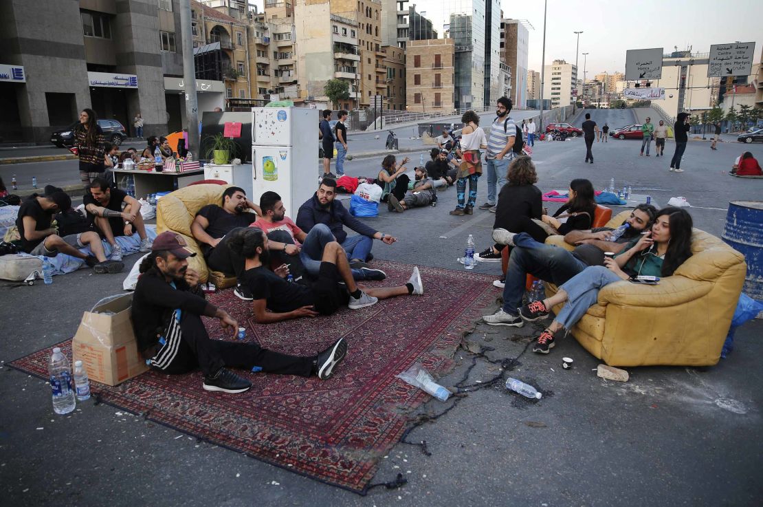 Protesters sit in the middle of a highway during anti-government demonstrations in Beirut, Lebanon, on October 28.