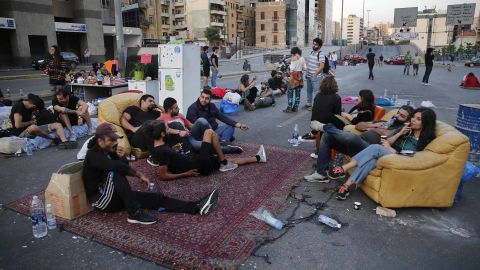Protesters sit in the middle of a highway during anti-government demonstrations in Beirut, Lebanon, on October 28.