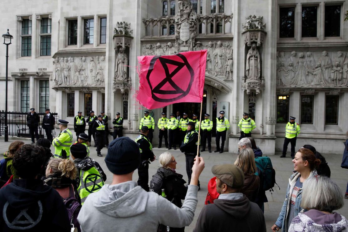 Climate activists protest outside the Supreme Court, during the eleventh day of demonstrations by the climate change action group Extinction Rebellion, in London, on October 17, 2019.