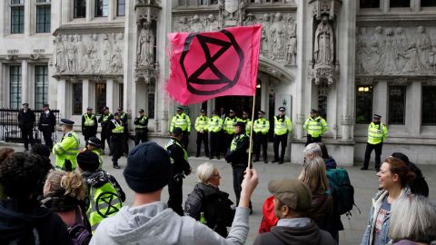 Climate activists protest outside the Supreme Court, during the eleventh day of demonstrations by the climate change action group Extinction Rebellion, in London, on October 17, 2019.