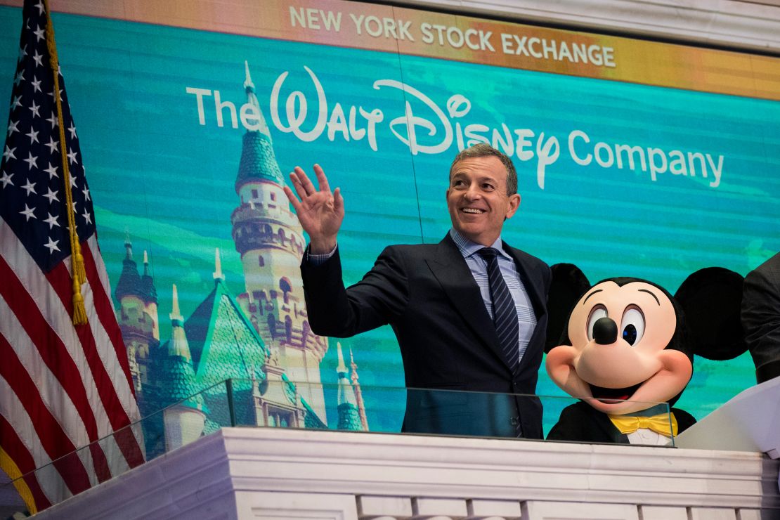 Bob Iger and Mickey Mouse look on before ringing the opening bell at the New York Stock Exchange in November 2017, marking the company's 60th anniversary as a publicly-traded company. (Drew Angerer/Getty Images)