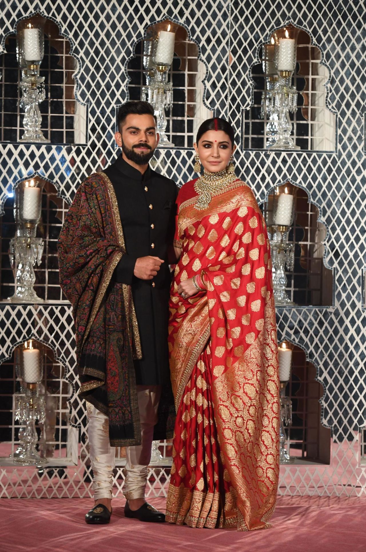 Bollywood actress Anushka Sharma wears a Banarasi sari to her wedding to Indian cricketer Virat Kohli in New Delhi on December 21, 2017.

