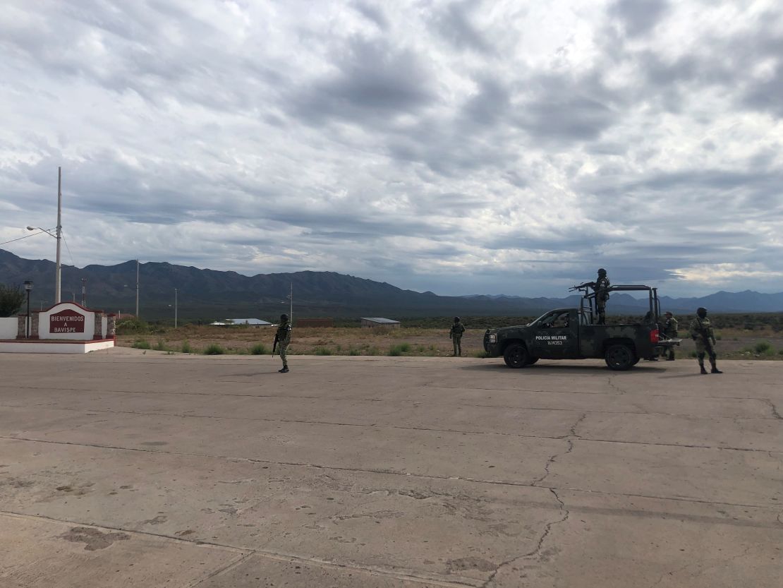 Mexican security personnel stand guard outside Bavispe -- the closest town to La Mora -- on Wednesday.