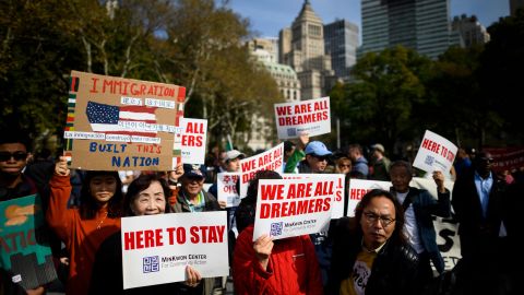 People take part in a kick-off rally of the "Home Is Here" March for DACA and TPS on October 26 in New York City.