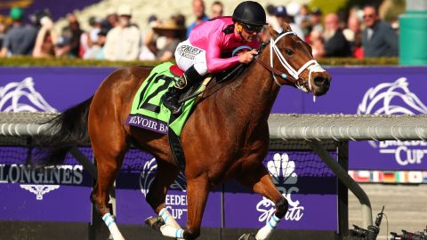 Javier Castellano riding Belvoir Bay across the finish line at Santa Anita Park.