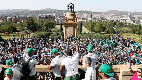 Springbok players celebrate from the Union Buildings, the seat of South Africa's government, before the start of their nation-wide trophy tour that will see the players engage with fans in Pretoria, Johannesburg, Soweto, Durban, East London, Port Elizabeth and Cape Town.