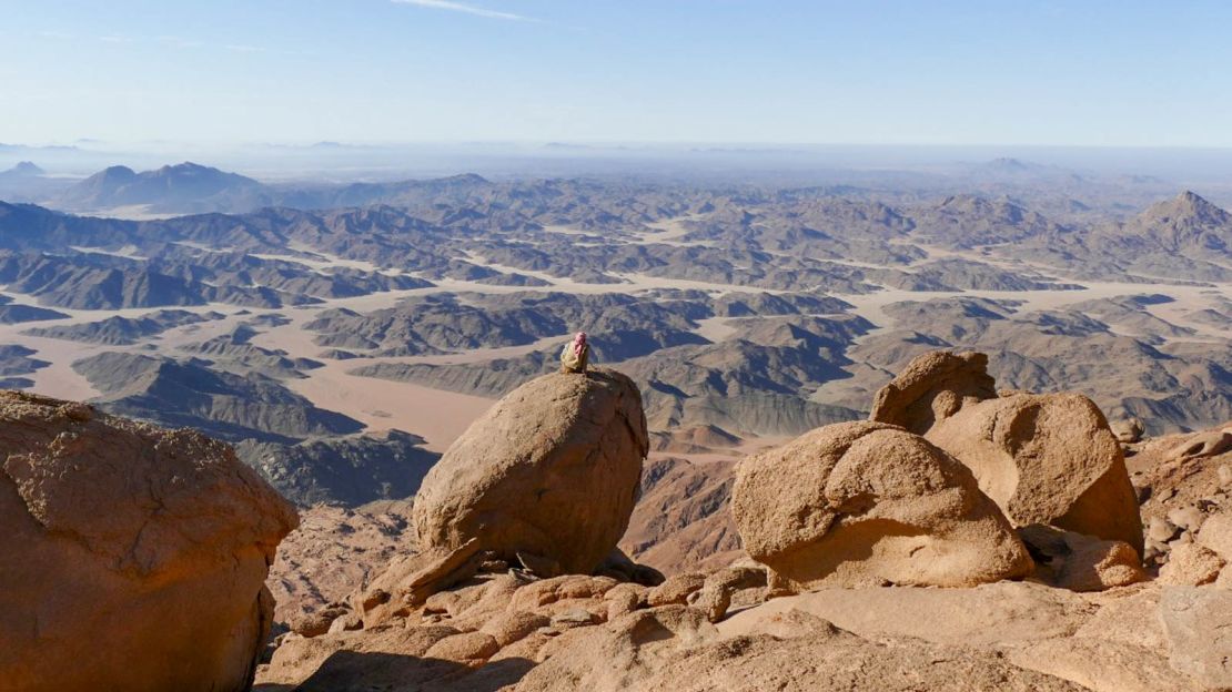 Mohammed Muteer of the Maaza tribe -- head guide on the Red Sea Mountain Trail -- gazes south over desert lowlands from the peak of Jebel Um Anab.