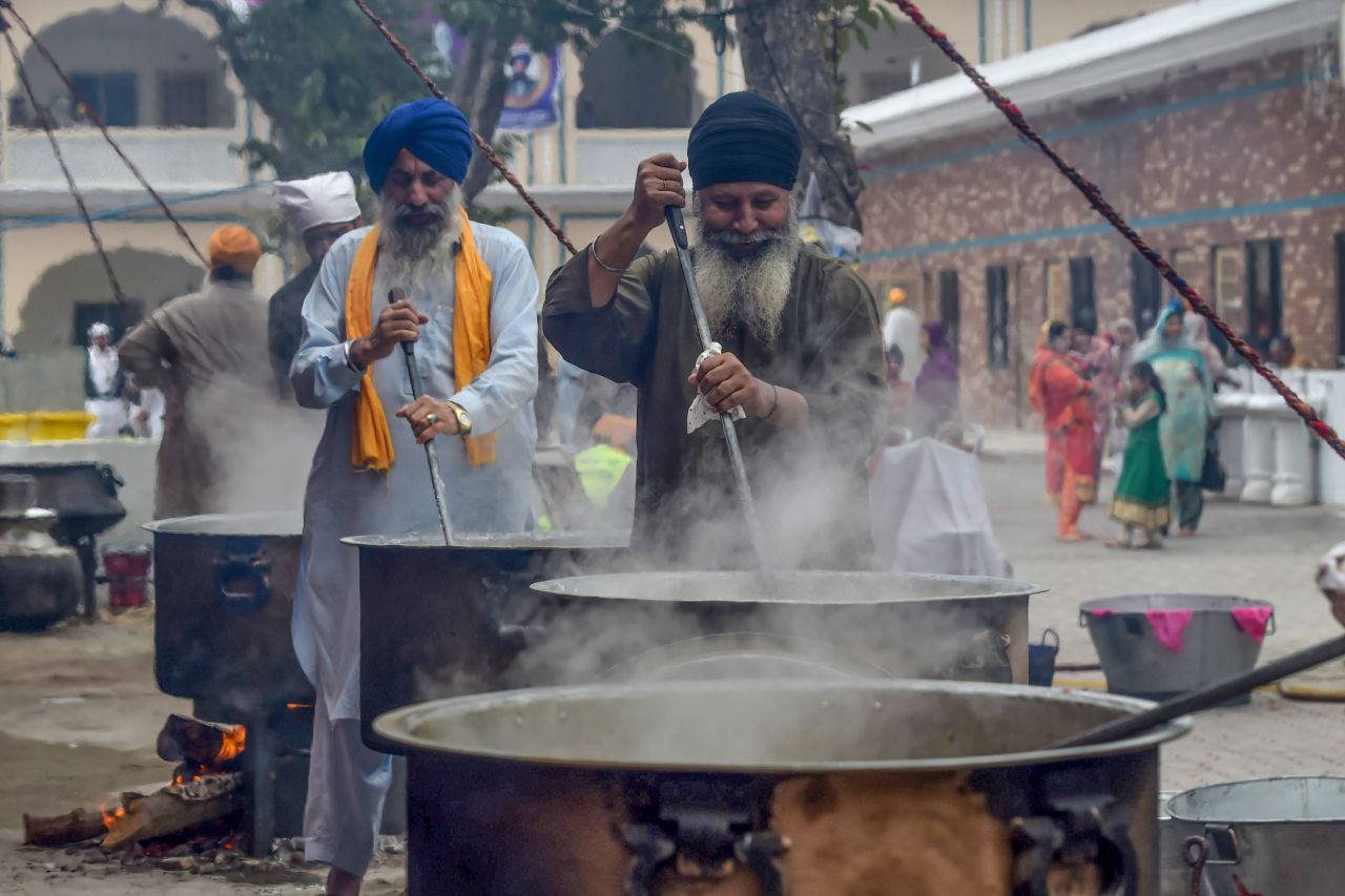Sikh pilgrims prepare food for devotees at a shrine in Nankana Sahib in Pakistan. 