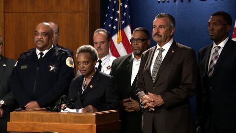 From left, Chicago Police Superintendent Eddie Johnson, Mayor Lori Lightfoot and former LAPD Chief Charlie Beck.