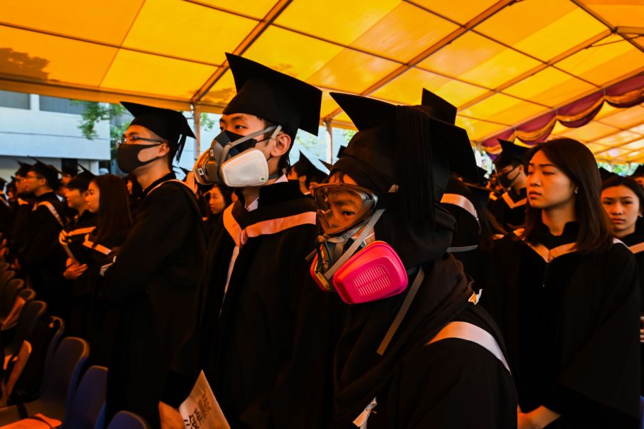 Students in gas masks are seen during a graduation ceremony at the Chinese University of Hong Kong on Thursday, November 7 in Hong Kong.