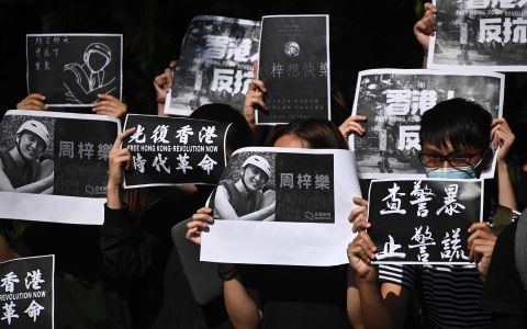 Students of the Hong Kong University of Science and Technology (HKUST) participate in a march on November 8, after hospital officials confirmed the <a href=