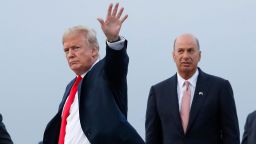 In this July 10, 2018, file photo, President Donald Trump is joined by Gordon Sondland, the U.S. ambassador to the European Union, second from right, as he arrives at Melsbroek Air Base, in Brussels, Belgium. 