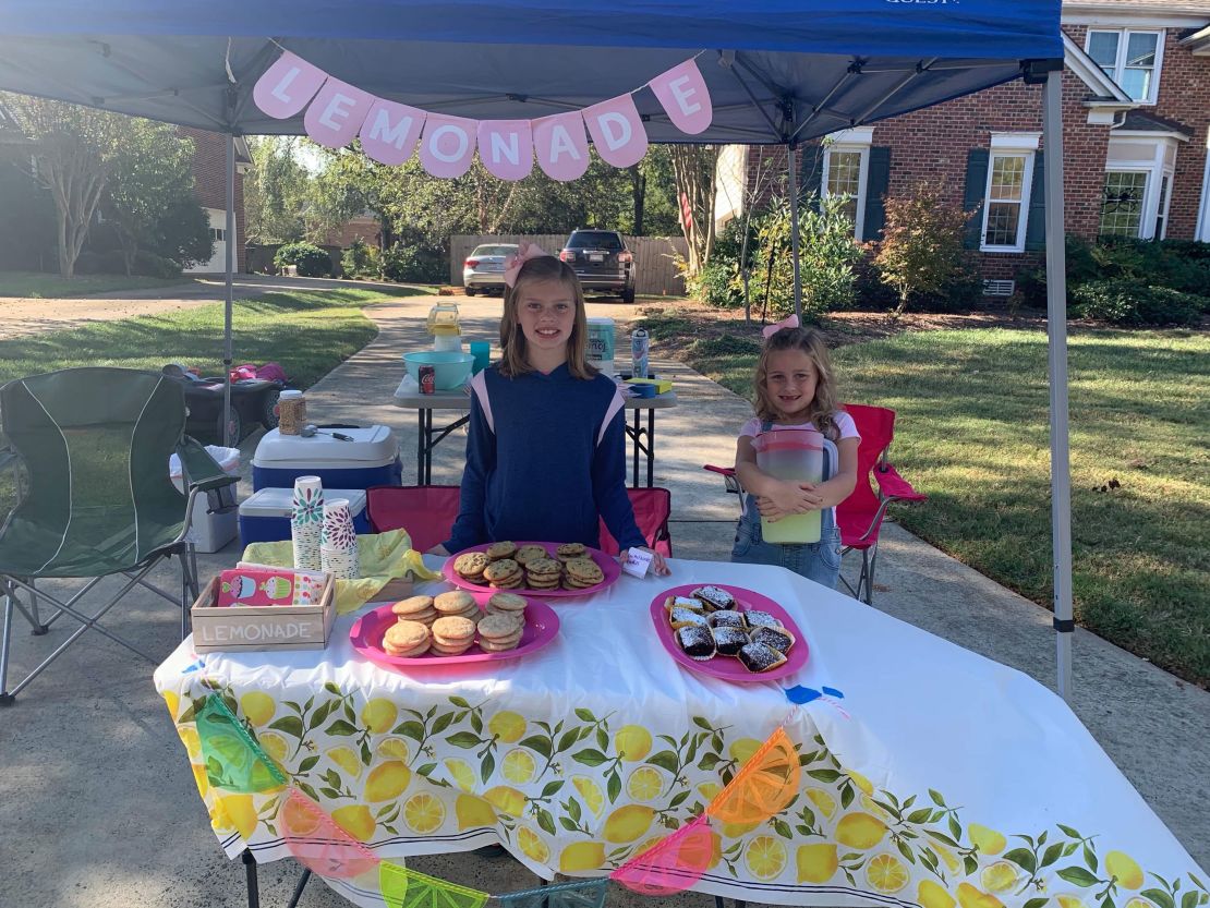 Alex, left, and Caroline made $969 in cash from their lemonade stand this year. They raised almost $2,000 additional funds through donations.
