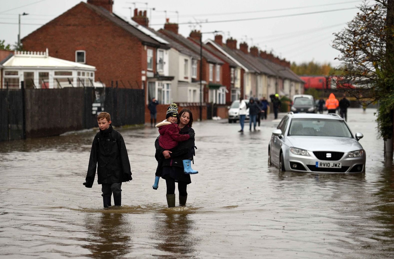 Residents walk through floodwaters in Doncaster, England, on November 8.