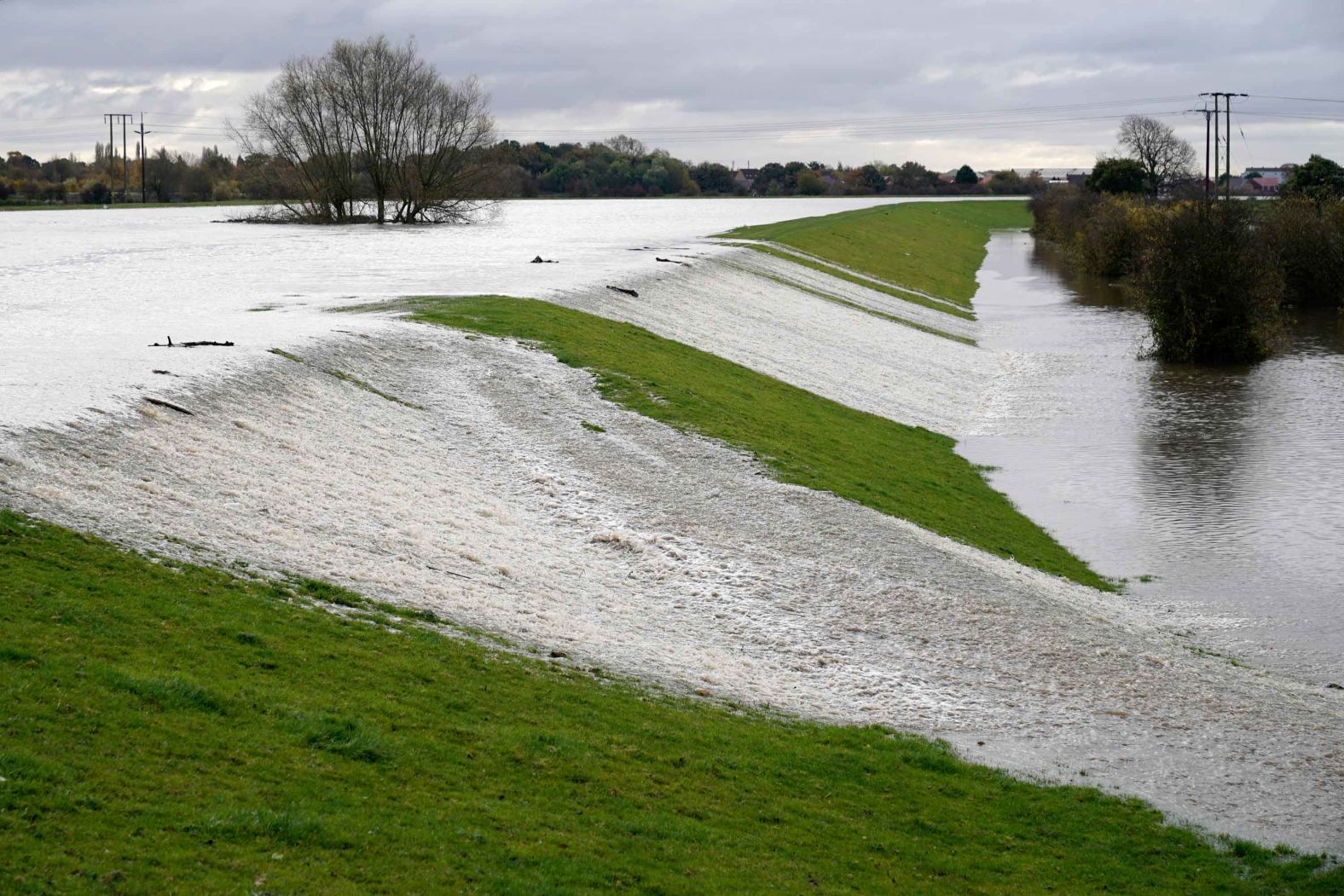The River Don washes over its banks on Friday in Barnby Dun, near Doncaster.