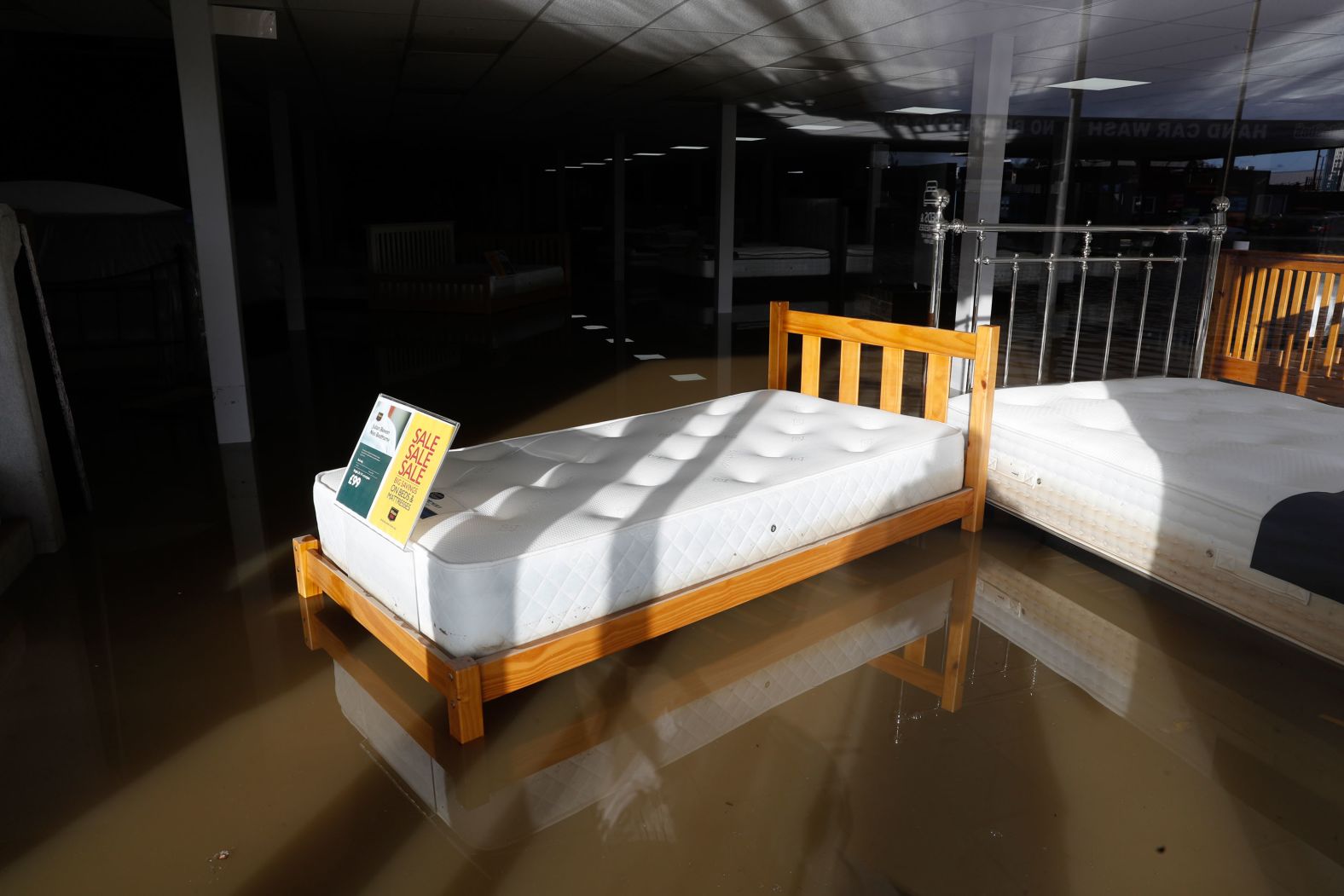 A bed in a flooded shop is seen in Rotherham.