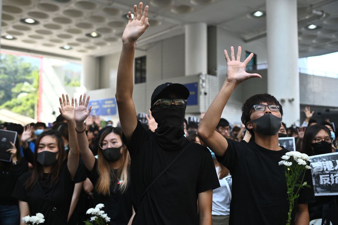Students of the Hong Kong University of Science and Technology (HKUST) participate in a march towards HKUST president Wei Shyy's lodge in Hong Kong on November 8, 2019, following the death earlier in the day of student Chow Tsz-lok. 