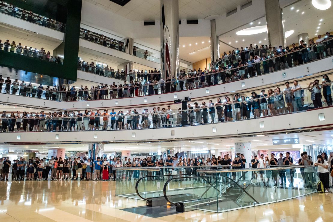 Residents and protesters sing songs and shout slogans as they gather at a shopping mall after business hours in Tai Koo district September 9, 2019 in Hong Kong, China. 