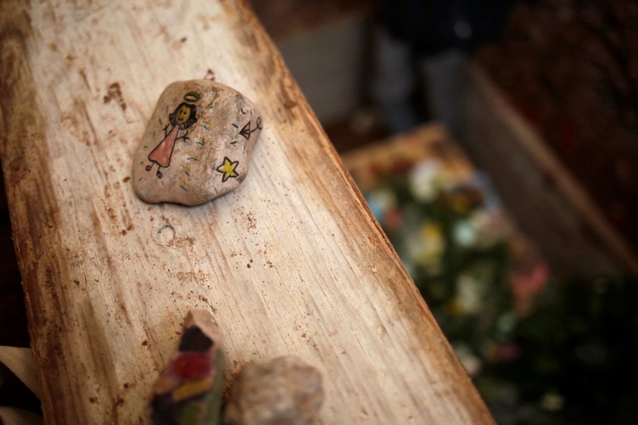 A stone with a drawing by Kristal's friends is seen before the funeral.