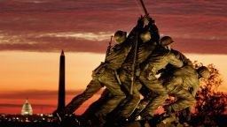 The early morning sun begins to rise behind the Iwo Jima Memorial on November 11 in Arlington, Virginia.  (Photo by Mark Wilson/Getty Images)