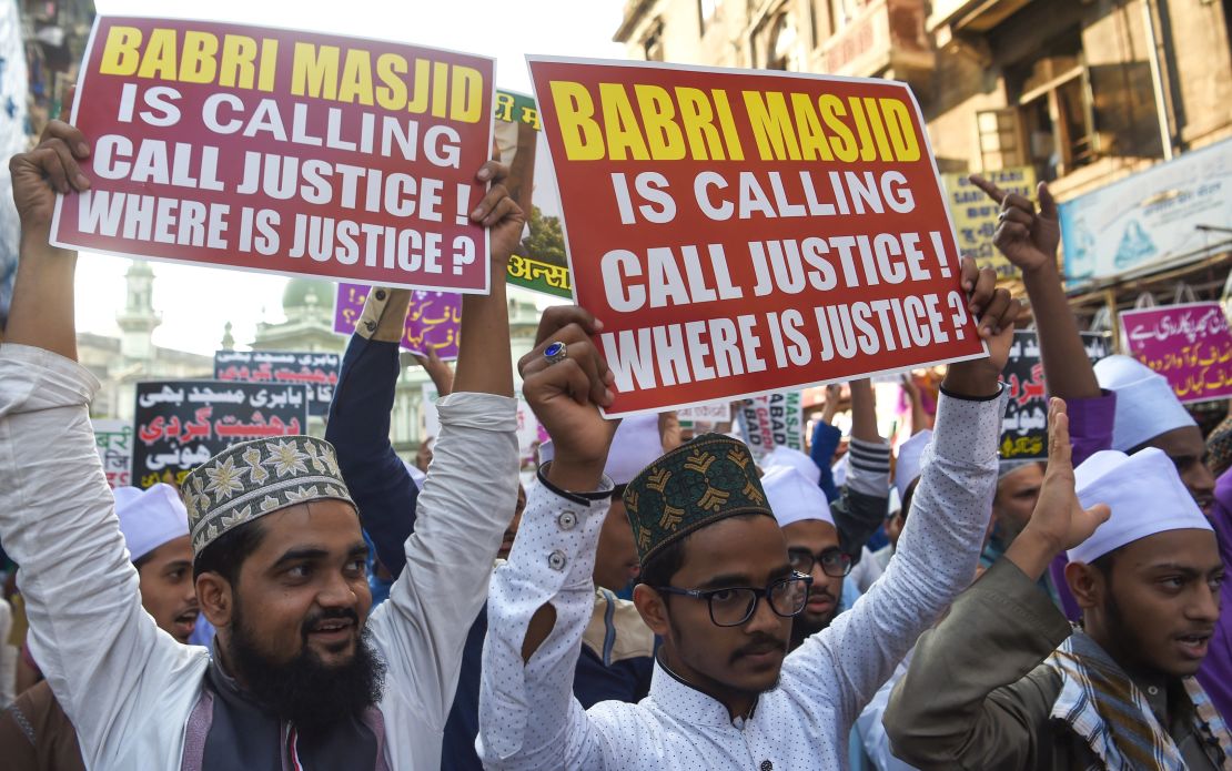Indian Muslim supporters and activists take part in a protest to mark the 26th anniversary of the demolition of the 16th century Babri Masjid.
