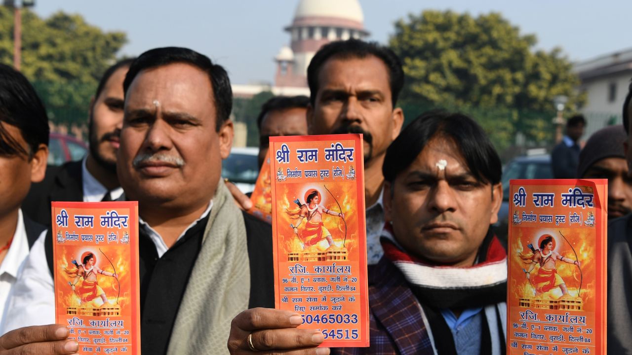 Indian Hindu protesters hold leaflets with the picture of Lord Ram outside the Indian Supreme Court in New Delhi on January 10, 2019.