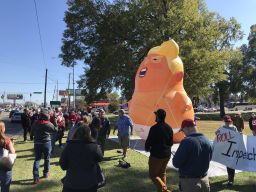 A 20-foot tall balloon resembling President Trump has made an appearance at the highly anticipated college football game between the University of Alabama and Louisiana State University.