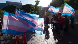 Members of the transgender and gender non-binary community and their allies gather to celebrate  International Transgender Day of Visibility, March 31, 2017 at the Edward R. Roybal Federal Building in Los Angeles, California. 
International Transgender Day of Visibility is dedicated to celebrating transgender people and raising awareness of discrimination faced by transgender people worldwide. / AFP PHOTO / Robyn Beck        (Photo credit should read ROBYN BECK/AFP via Getty Images)